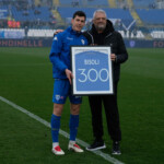Dimitri Bisoli of Brescia Calcio FC Team takes takes an trophy for his 300 games with Brescia Calcio jersey from Alessandro Altobelli during the Italian Serie B soccer championship match between Brescia Calcio and FC Sudtirol at Mario Rigamonti Stadium on February 23, 2025, Brixia, Italy.